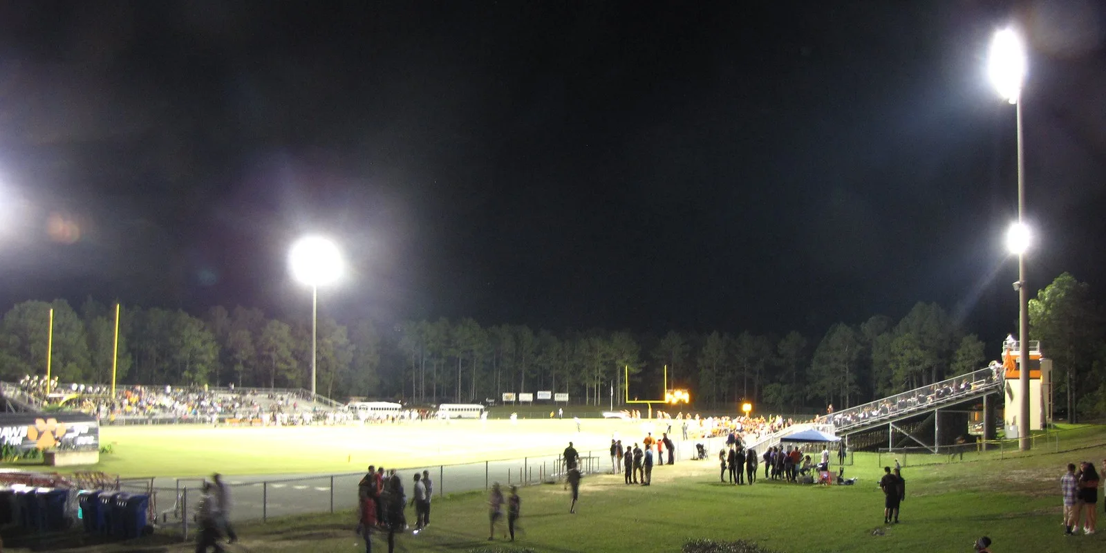 Stadium lights shine on a Friday night high school football game at South View High School in Hope Mills, N.C.