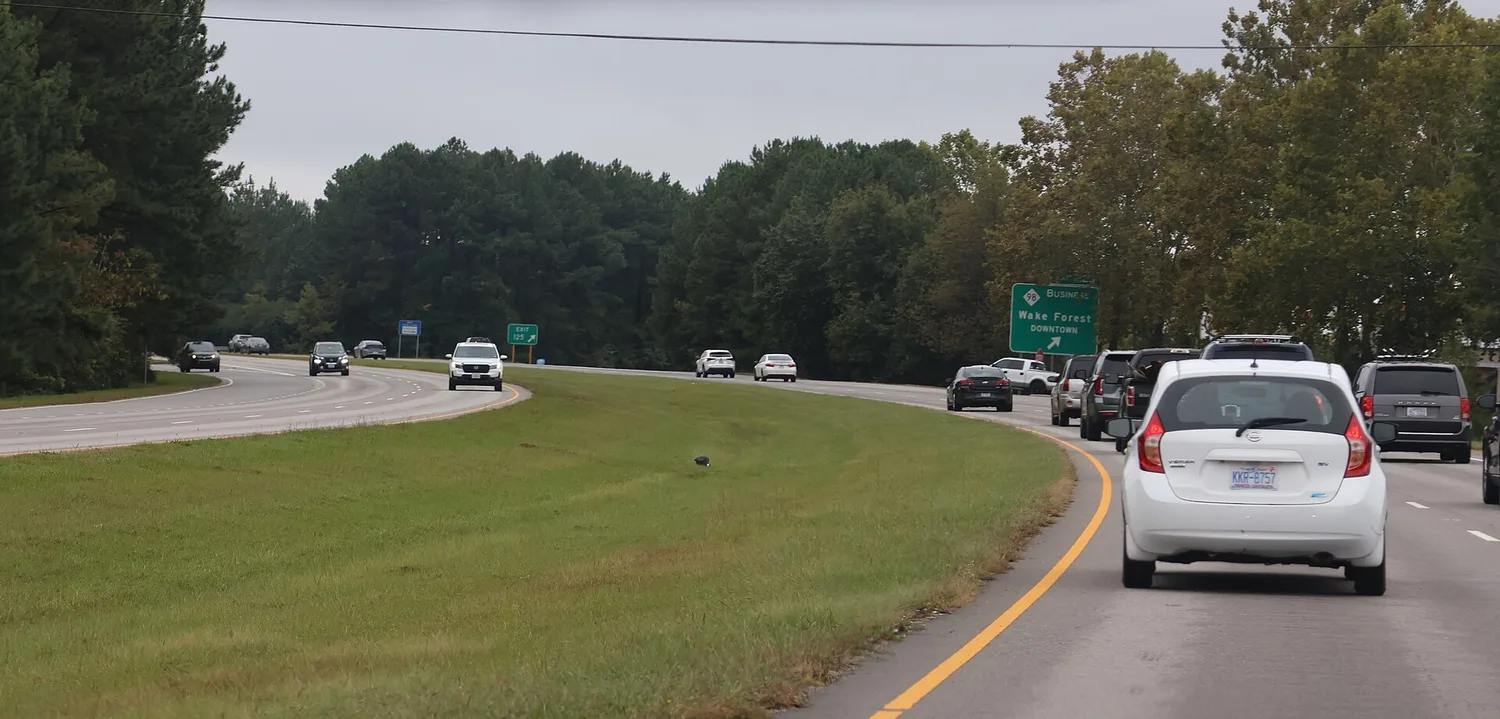 Southbound traffic on U.S. 1 passes the N.C. 98 Business exit sign for downtown Wake Forest.