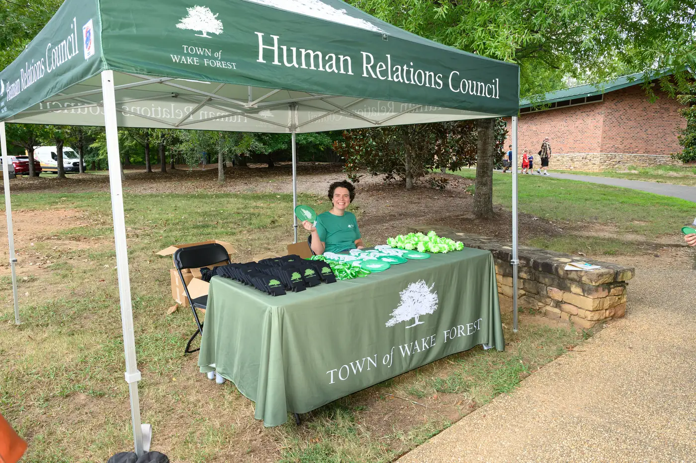 The Wake Forest Human Relations Council's tent on the lawn at E. Carroll Joyner Park during Good Neighbor Day.