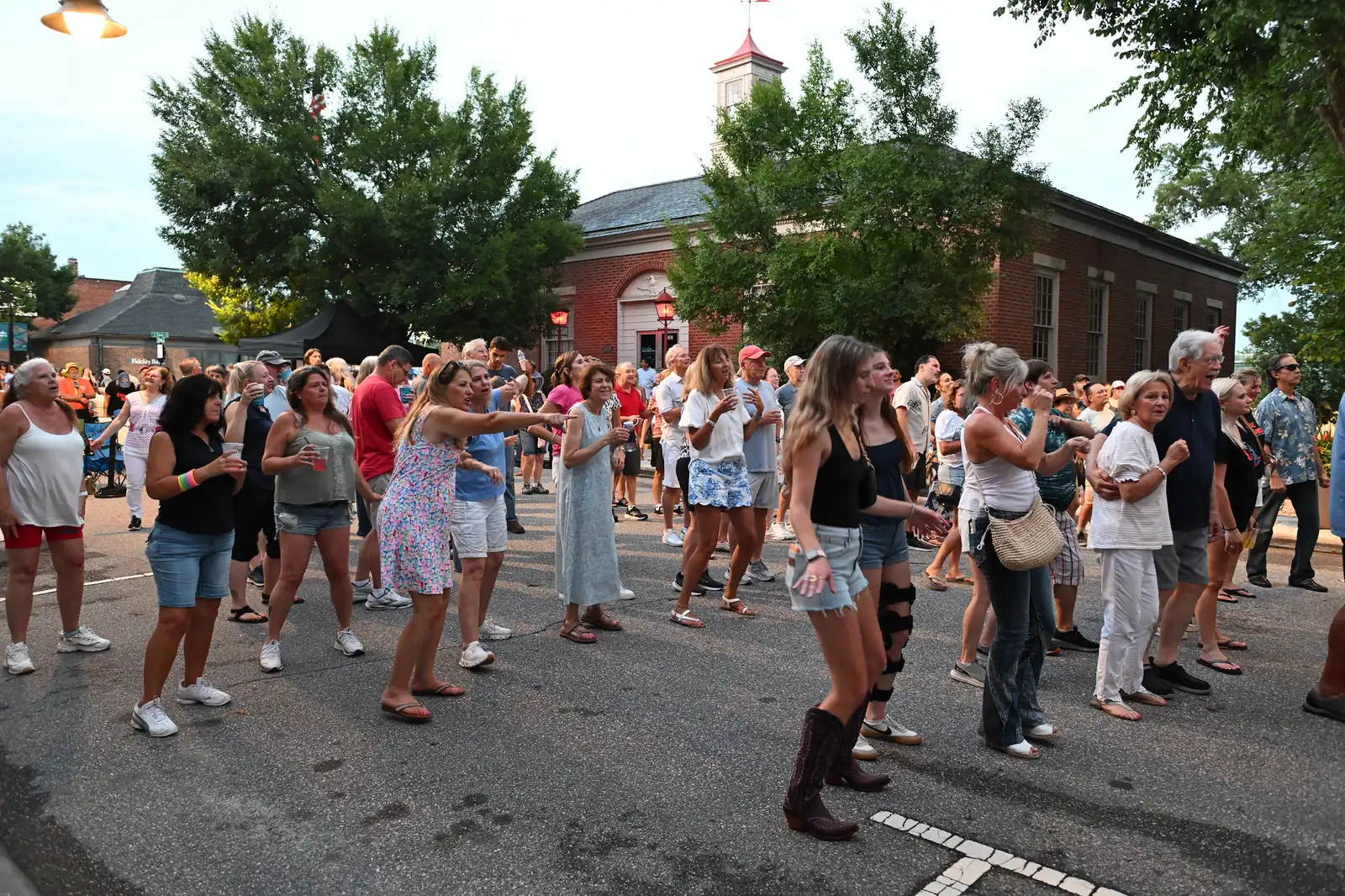 An evening crowd fills South White Street in downtown Wake Forest, where the Spirits of Wake Forest ghost walks tell the district's stories each October.