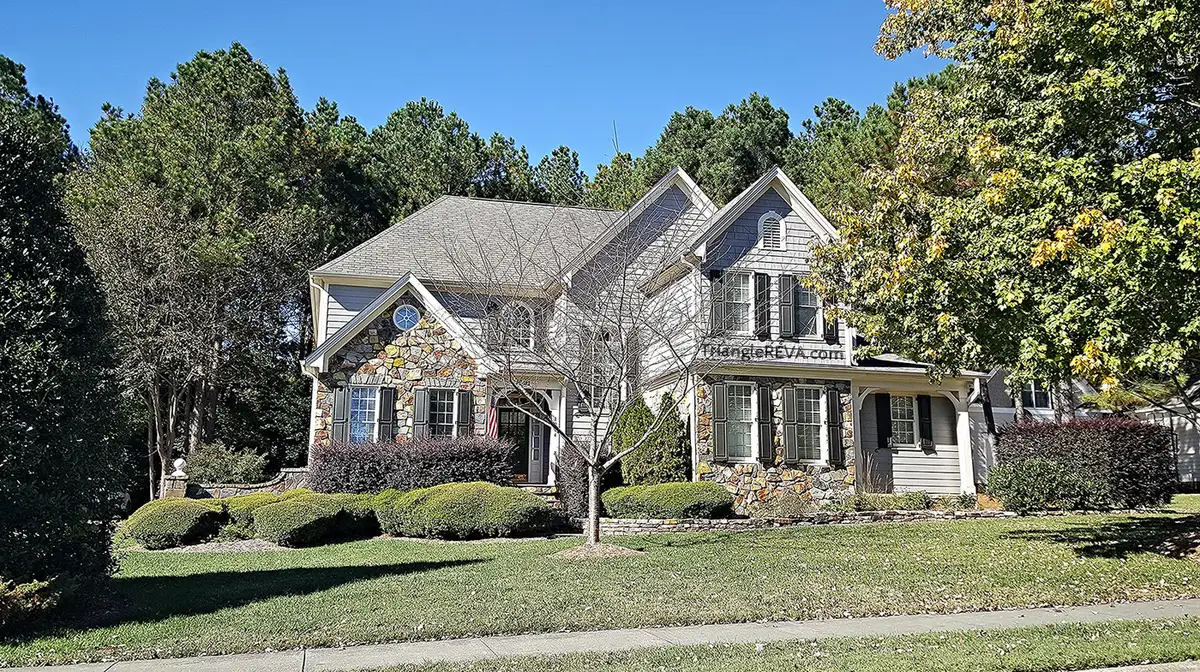 A two-story house with stone and siding in the Crenshaw Hall neighborhood of Wake Forest.