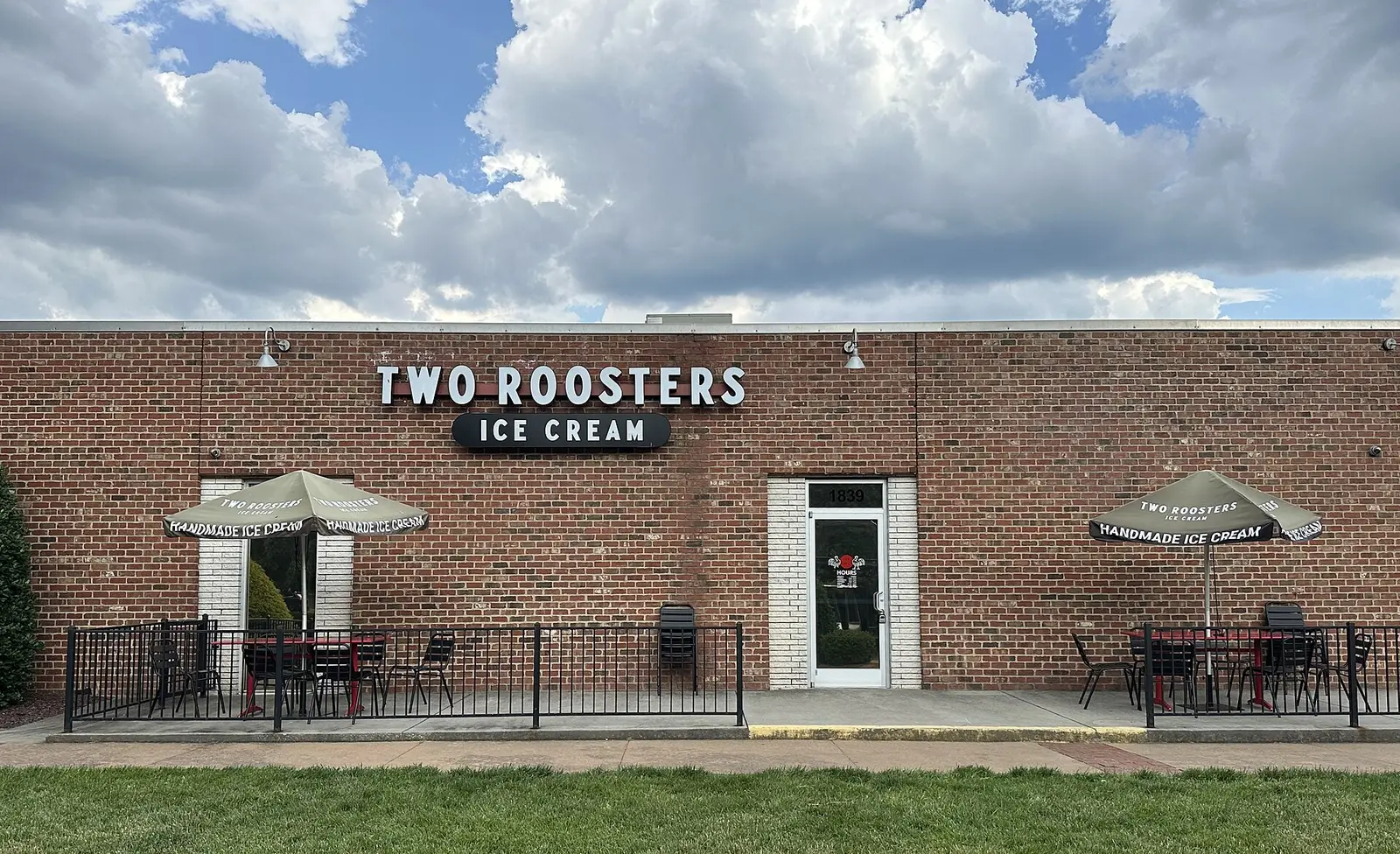 Two Roosters Ice Cream at The Factory, 1839 S. Main St., Wake Forest, with umbrella tables outside.