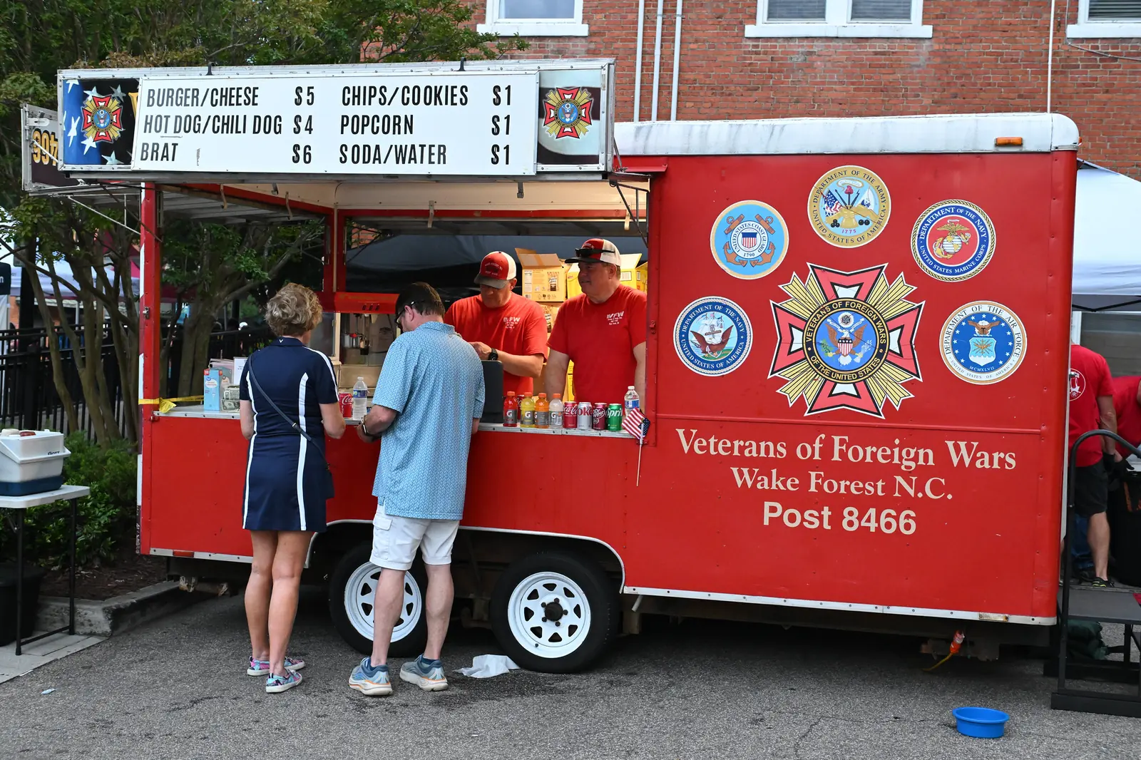 Veterans of Foreign Wars Post 8466 of Wake Forest serves food from its trailer at a Friday Night on White concert downtown.