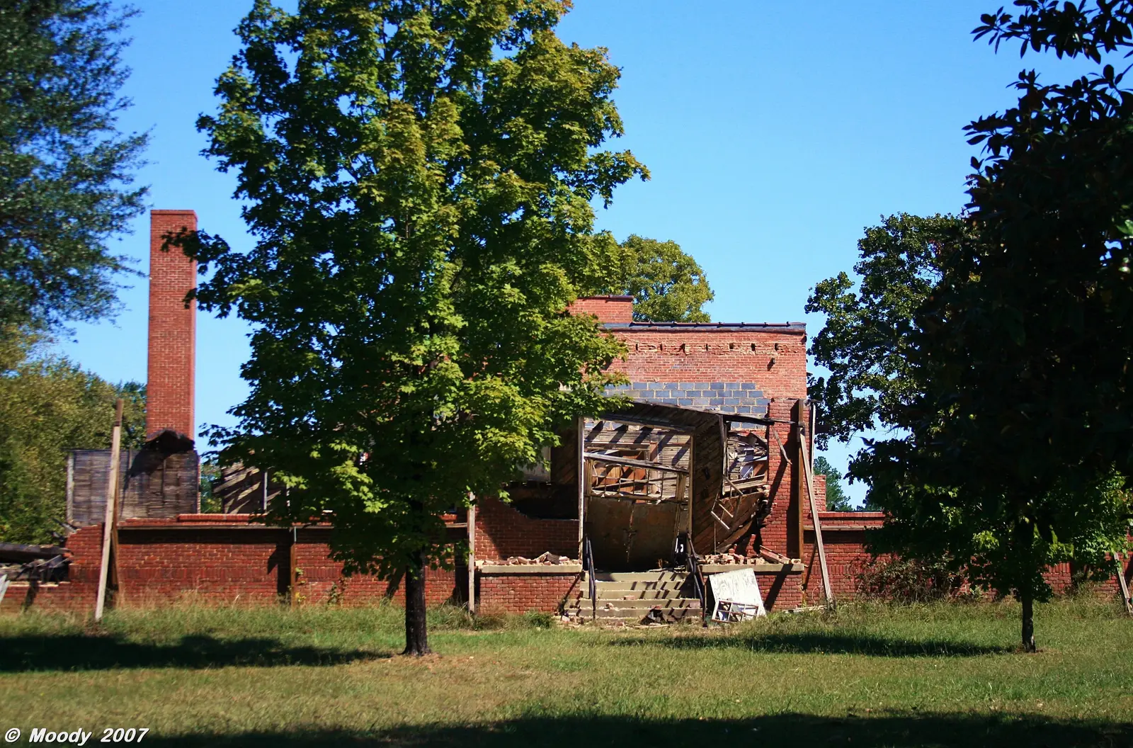 The building that housed the music, art and band rooms of the former W.E.B. DuBois School in Wake Forest's Northeast Community, photographed in 2007, with the old heating stack behind it.