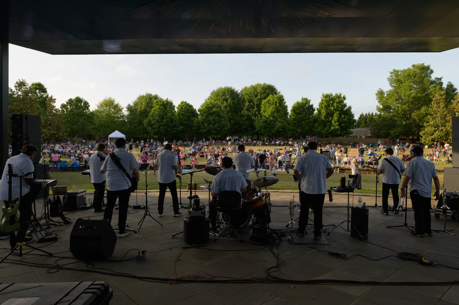 A band plays to a crowd on the lawn at E. Carroll Joyner Park in Wake Forest during the Six Sundays in Spring concert series.