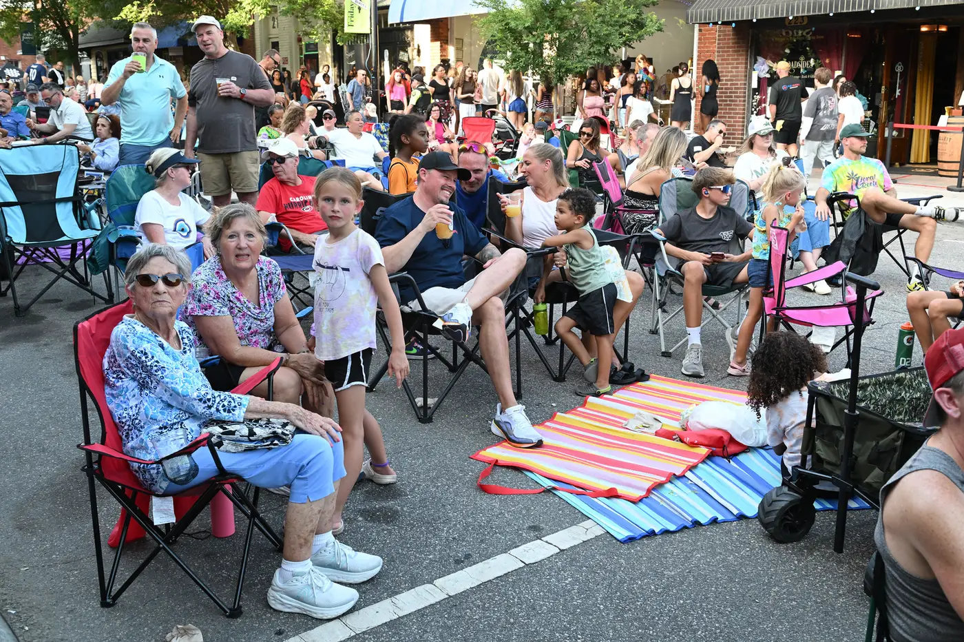 Families of all ages fill South White Street in lawn chairs during a Friday Night on White concert in downtown Wake Forest.