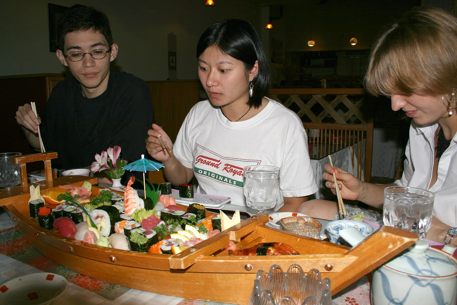 Diners with a boat of sushi at a Japanese restaurant in Durham, N.C. The photo was not taken in Wake Forest.