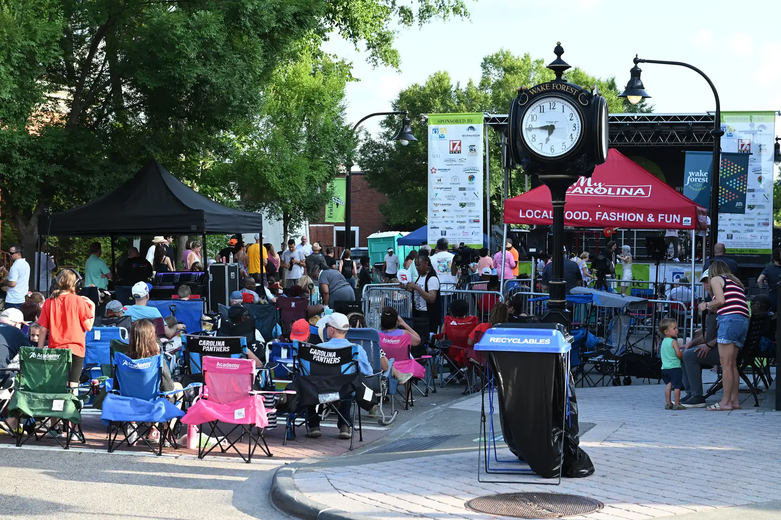 Lawn chairs fill the corner by the Wake Forest street clock on South White Street during a Friday Night on White concert in downtown Wake Forest.