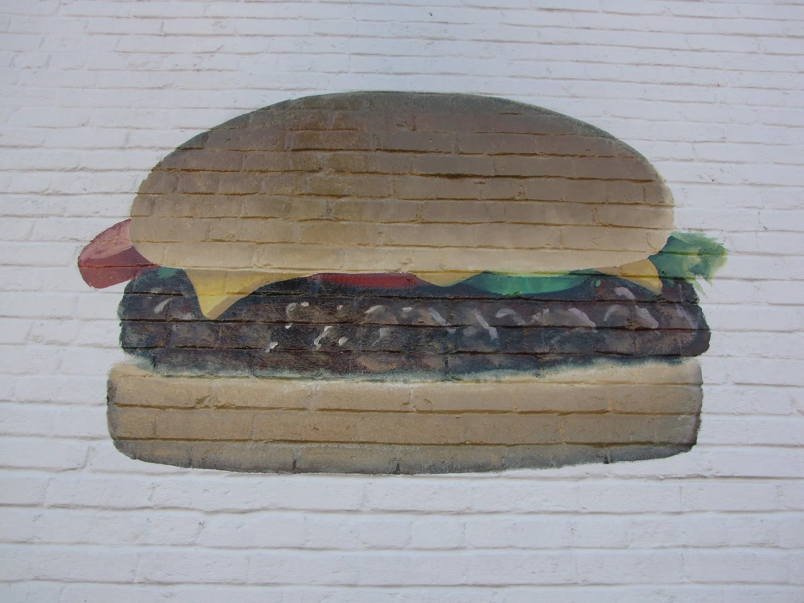 A cheeseburger on a plate. The photo was not taken at a Wake Forest restaurant.