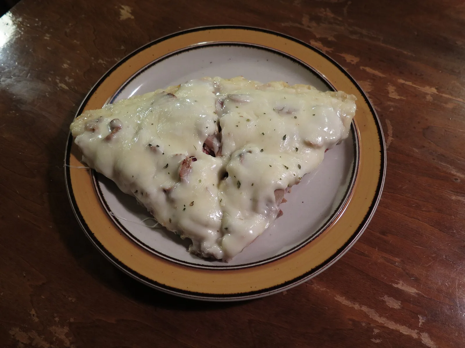 Two slices of supreme pizza on a plate. The photo was not taken at a Wake Forest restaurant.